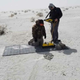 Cyrus Green (left) and Tommy Urban (right) collecting ground-penetrating radar data at White Sands National Monument.